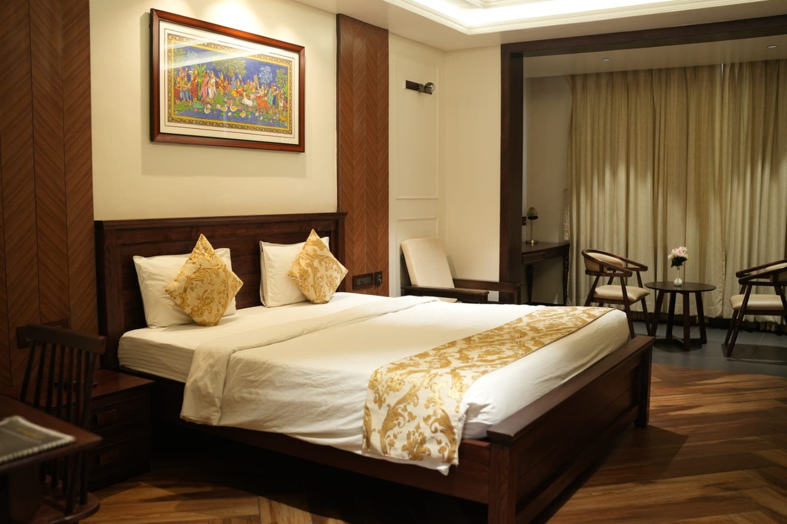 Super Deluxe room with herringbone wood and Pattachitra painting